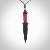 Hand carved dagger made from black jade. The cord is adjustable so that you can wear this where it suits you best. We ship this worldwide and the postage is included in the price.